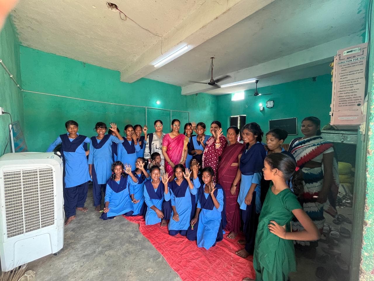 Women learning tailoring and literacy skills at Silai Sah Padhai Kendra